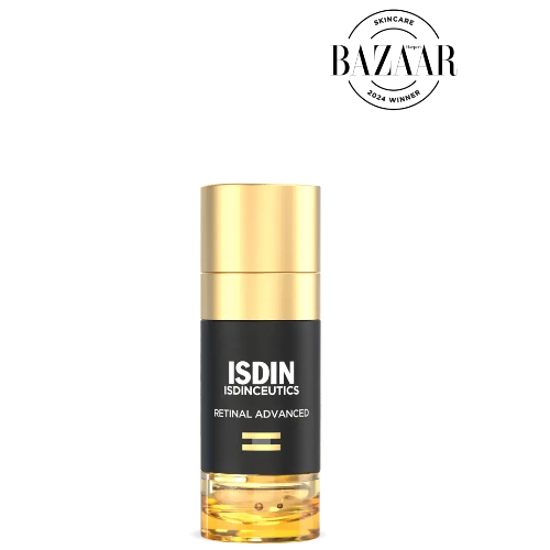 ISDIN skincare bottle with gold cap on a white background, featuring the Harper Bazaar award logo.
